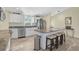 Modern kitchen with granite countertops and island seating at 6297 Drucker Cir, Port Charlotte, FL 33981
