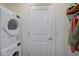 Laundry room with stackable washer and dryer at 6297 Drucker Cir, Port Charlotte, FL 33981