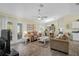 Bright living room with tile floors and access to back patio at 6297 Drucker Cir, Port Charlotte, FL 33981
