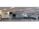 Meeting room with rows of chairs, a stage, and a presentation area at 6297 Drucker Cir, Port Charlotte, FL 33981