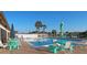 Inviting community pool with turquoise furniture and palm trees at 6297 Drucker Cir, Port Charlotte, FL 33981