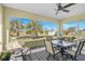 Relaxing screened porch with table, chairs, and view of backyard at 6297 Drucker Cir, Port Charlotte, FL 33981