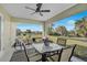 Spacious screened-in porch with seating area and ceiling fan at 6297 Drucker Cir, Port Charlotte, FL 33981