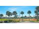 Tennis courts surrounded by palm trees and lush greenery at 6297 Drucker Cir, Port Charlotte, FL 33981