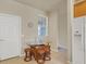 Breakfast nook in the kitchen with a glass-top table and wicker chairs at 6370 Falcon Lair Dr, North Port, FL 34287