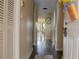 Hallway entrance with hardwood floors and neutral-toned walls at 7102 Jessie Harbor Dr # 7102, Osprey, FL 34229