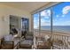 Spacious balcony with ocean view and comfortable seating at 811 The Esplanade N # 402, Venice, FL 34285