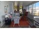 Bright sunroom with wicker furniture and dining table at 858 S Green Cir # 506, Venice, FL 34285