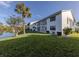 Condo building exterior with water view at 1100 Capri Isles Blvd # 221, Venice, FL 34292