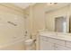 Clean bathroom with tub, toilet, and white vanity at 11539 Okaloosa Dr, Venice, FL 34293