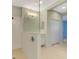 Bathroom with walk-in shower, glass partition, and tile flooring at 11539 Okaloosa Dr, Venice, FL 34293