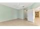 Light and airy bedroom with access to hallway at 11539 Okaloosa Dr, Venice, FL 34293