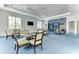 Community room offering comfortable seating and built-in shelving at 11539 Okaloosa Dr, Venice, FL 34293