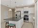 Bright kitchen, stainless steel appliances, and an island at 11539 Okaloosa Dr, Venice, FL 34293