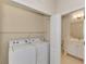 Laundry room with washer, dryer, and shelving at 11539 Okaloosa Dr, Venice, FL 34293