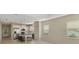 Bright living room with kitchen and access to backyard at 11539 Okaloosa Dr, Venice, FL 34293