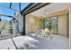 Covered patio with sliding doors to interior at 11539 Okaloosa Dr, Venice, FL 34293