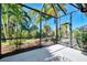 Spacious screened patio with lush landscaping at 11539 Okaloosa Dr, Venice, FL 34293