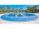 Circular splash pad with colorful spray features for  at 11539 Okaloosa Dr, Venice, FL 34293