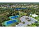 Two well-maintained tennis courts with surrounding green space at 11539 Okaloosa Dr, Venice, FL 34293