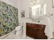 Clean bathroom with shower/tub combo and dark wood vanity at 1195 Collier Pl, Venice, FL 34293