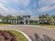 Community clubhouse with palm trees and landscaping at 1195 Collier Pl, Venice, FL 34293