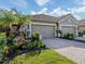 Two-car garage and nicely landscaped front yard at 1195 Collier Pl, Venice, FL 34293