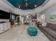 Open living room with teal ceiling, comfy seating, and kitchen view at 1195 Collier Pl, Venice, FL 34293