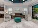 Spacious living room with teal ceiling and comfy seating at 1195 Collier Pl, Venice, FL 34293