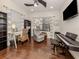 Home office space with built-in shelving and hardwood floor at 1195 Collier Pl, Venice, FL 34293