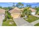 Single-Gathering home with attached garage and lush landscaping at 125 Amora Ave, Venice, FL 34285