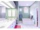 Bathroom with double vanity, bathtub, and shower at 125 Amora Ave, Venice, FL 34285