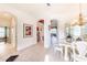 Formal dining area with white table and chairs, near the entryway at 125 Amora Ave, Venice, FL 34285
