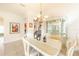 Bright dining room with a white table and chairs at 125 Amora Ave, Venice, FL 34285