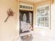 Inviting front entry with a decorative door and screen at 125 Amora Ave, Venice, FL 34285
