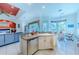 Kitchen with island, stainless steel appliances, and breakfast bar at 125 Amora Ave, Venice, FL 34285