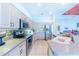 Modern kitchen featuring stainless steel appliances and granite countertops at 125 Amora Ave, Venice, FL 34285
