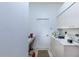 Laundry room with washer, dryer, and built-in cabinets at 125 Amora Ave, Venice, FL 34285