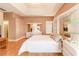 Spacious main bedroom with large bed and mirrored dresser at 125 Amora Ave, Venice, FL 34285