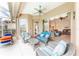 Comfortable patio with wicker furniture offering views of the living room and pool at 125 Amora Ave, Venice, FL 34285