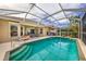 Relaxing screened pool area with ample lounge space at 125 Amora Ave, Venice, FL 34285