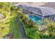Relaxing pool area with lush landscaping at 125 Amora Ave, Venice, FL 34285