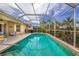 Refreshing pool with a screened enclosure at 125 Amora Ave, Venice, FL 34285