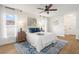 Main bedroom with a comfortable bed, ceiling fan, and plenty of natural light at 1255 Paradise Way, Venice, FL 34285