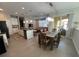 Open kitchen and dining area with an island and modern appliances at 128 Navigation Cir # 103, Osprey, FL 34229