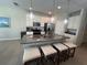 Spacious kitchen with stainless steel appliances and an island with seating at 128 Navigation Cir # 103, Osprey, FL 34229