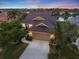 Beautiful aerial view of the home, showcasing its tile roof and well-maintained landscaping at 1307 Highland Greens Dr, Venice, FL 34285