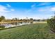 Lush backyard with a scenic waterfront view, perfect for relaxation and enjoying nature at 1307 Highland Greens Dr, Venice, FL 34285