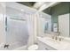 Well-lit bathroom with a tub/shower, large mirror, and modern fixtures at 1307 Highland Greens Dr, Venice, FL 34285