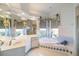 Charming bathroom featuring a garden tub, a vanity with mirror, and a walk-in shower at 1307 Highland Greens Dr, Venice, FL 34285